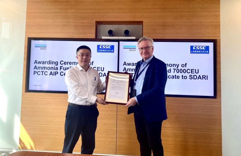 executives handing over the deal