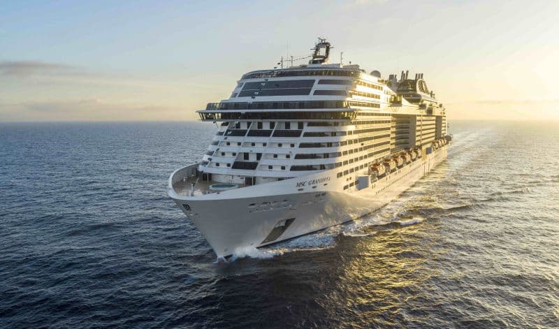 Sun-kissed MSC Grandiosa sails during a sunset