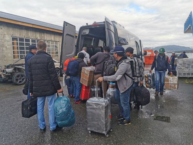 The crew of the MV Diavlos Force load the mini van on their way home following ITF assistance