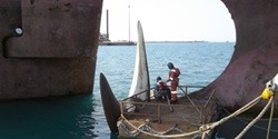 repairing ship propellers at sea
